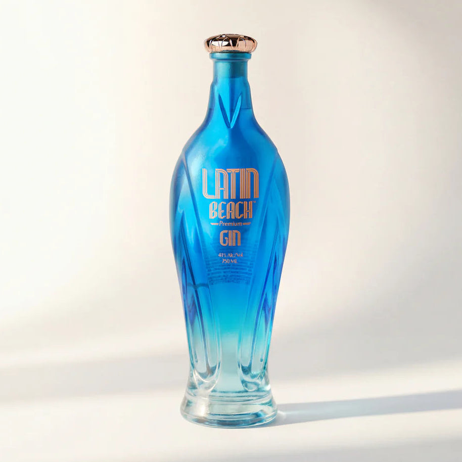 Load image into Gallery viewer, Blue bottle of Latin Beach Gin on a white background