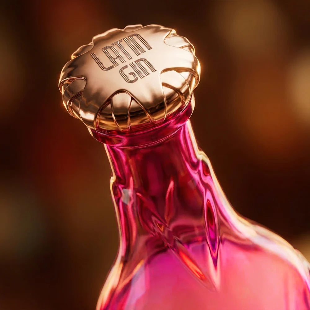 Load image into Gallery viewer, Pink Latin Lover Gin bottle with gold cap on a blurred background
