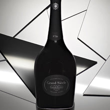 Load image into Gallery viewer, Black champagne bottle with &#39;Grand Siecle&#39; label on a reflective surface
