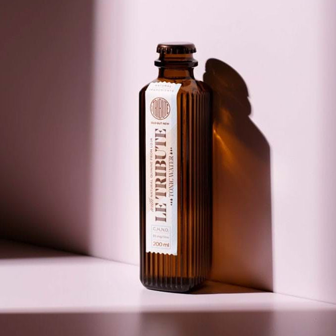 Load image into Gallery viewer, Le Tribute Tonic Water bottle with a label on a white surface