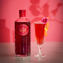 Load image into Gallery viewer, Bottle of Little Biddy Gin with a cocktail garnished with a flower on a pink background
