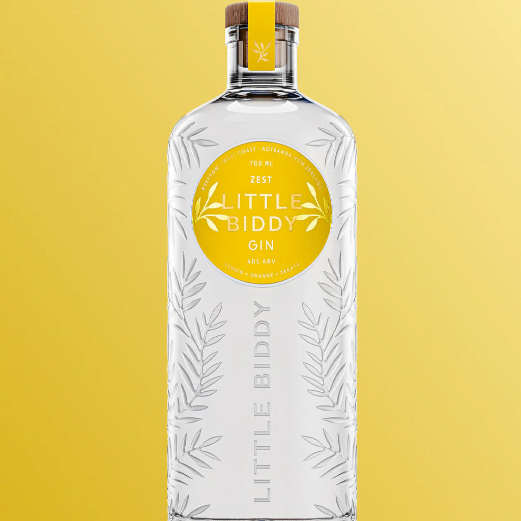 Bottle of Little Biddy Zest Gin on a yellow background