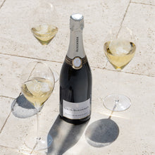 Load image into Gallery viewer, Bottle of Louis Roederer champagne with three glasses on a stone surface