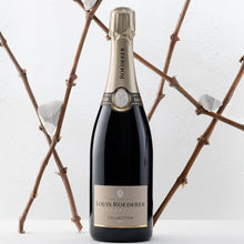 Load image into Gallery viewer, Louis Roederer champagne bottle with decorative branches in the background