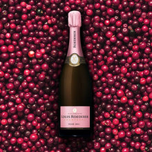Load image into Gallery viewer, Louis Roederer rosé champagne bottle surrounded by red berries