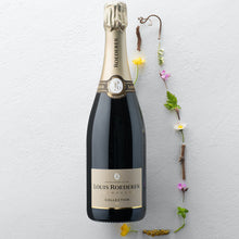 Load image into Gallery viewer, A bottle of Louis Roederer Collection Champagne on a white background with some flowers