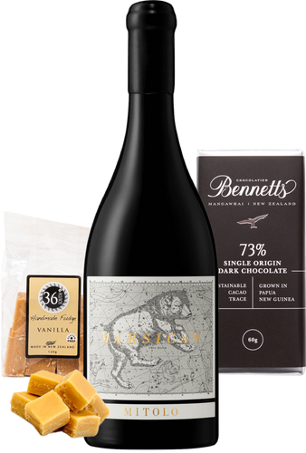 Wine bottle with Bennetts Dark chocolate and 36 Degrees vanilla fudge on a white background