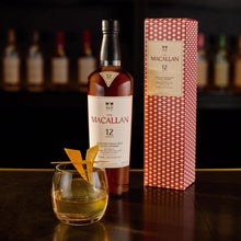 Load image into Gallery viewer, A bottle of the The Macallan 12 Year Old Single Malt Sherry Oak Cask Whisky with a whisky tumbler with ice and gift box