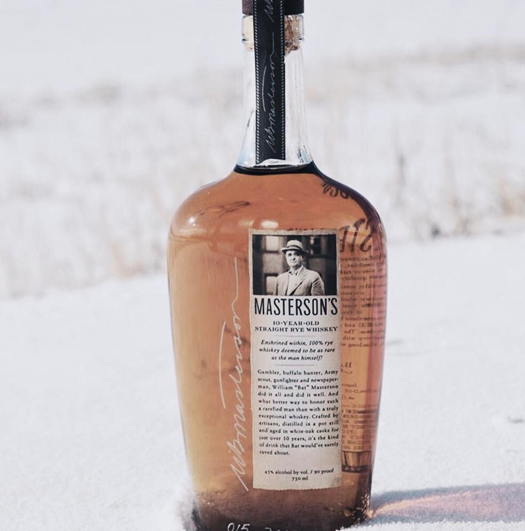 Load image into Gallery viewer, Masterson's 10 Year Old Straight Rye whiskey bottle in the snow