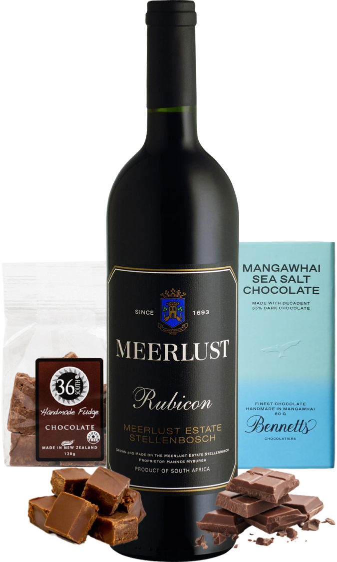 Load image into Gallery viewer, A bottle of Meerlust Rubicon red wine centered on a white background, flanked by chocolate products: a bag of 36 Degrees handmade fudge and chocolate pieces in front, and a light blue box of Bennett Mangawhai Sea Salt Chocolate on the right.