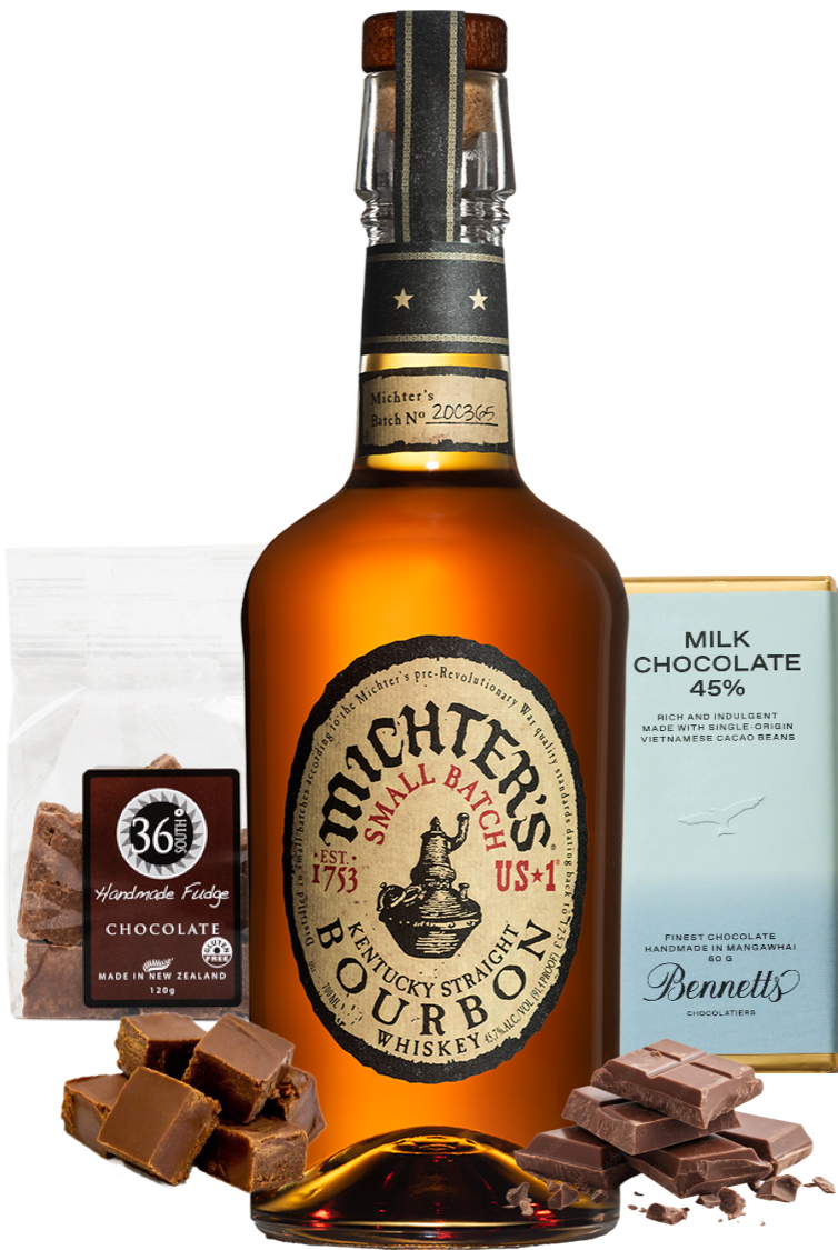 Load image into Gallery viewer, A bottle of Michter’s US1 Small Batch Kentucky Straight Bourbon whiskey  centred on a white background, surrounded by a Bennett's milk chocolate bar and chocolate pieces and a 36 Degrees Chocolate fudge packet and chocolate pieces. 