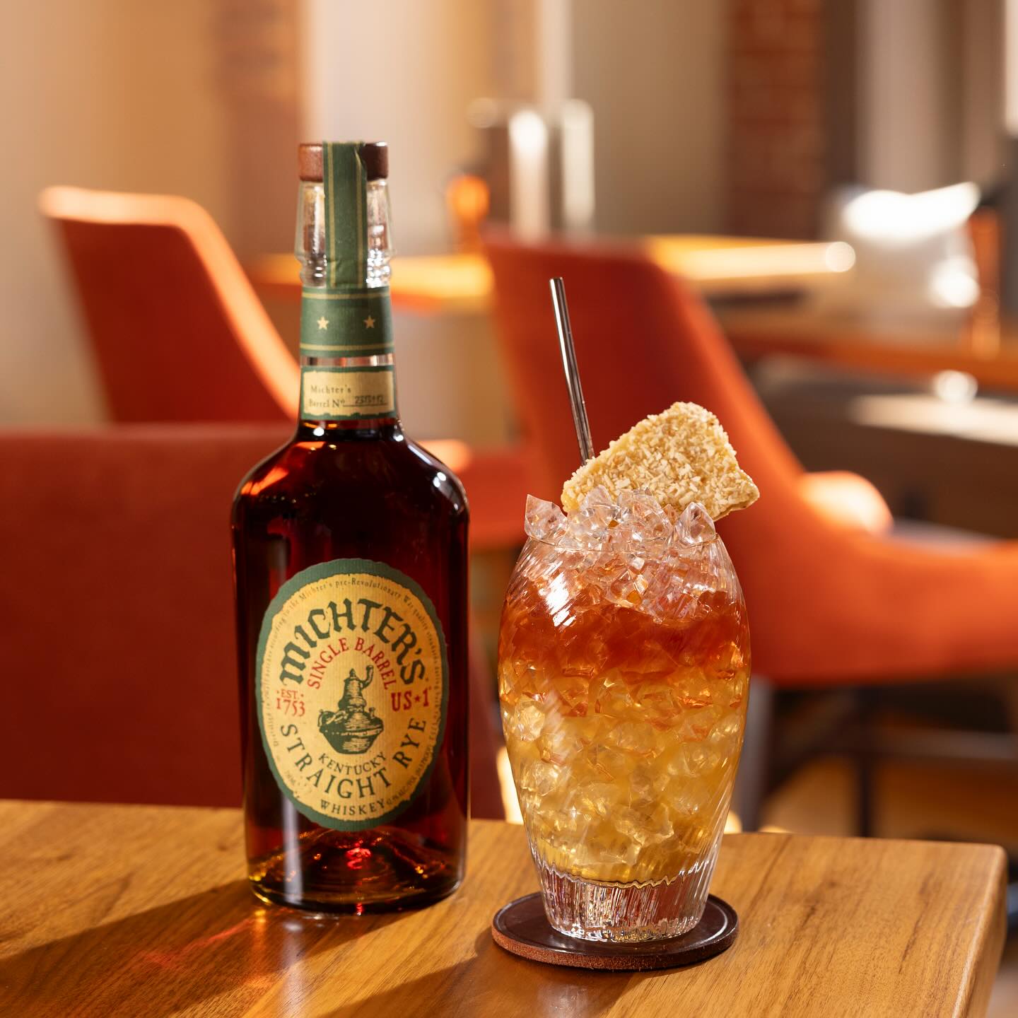 Load image into Gallery viewer, Michter's Michter’s US1 Single Barrel Rye Whiskey bottle with a cocktail on a wooden table