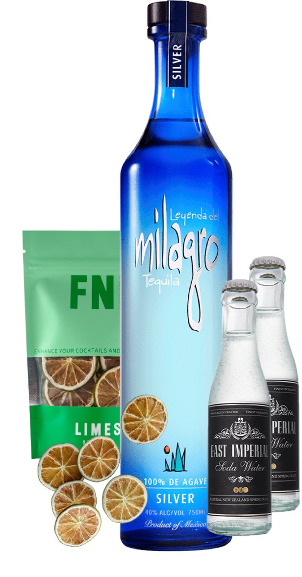 An image of a Milagro Silver Tequila Gift Box including 2 east imperial soda waters and a pouch on Lime garnish slices