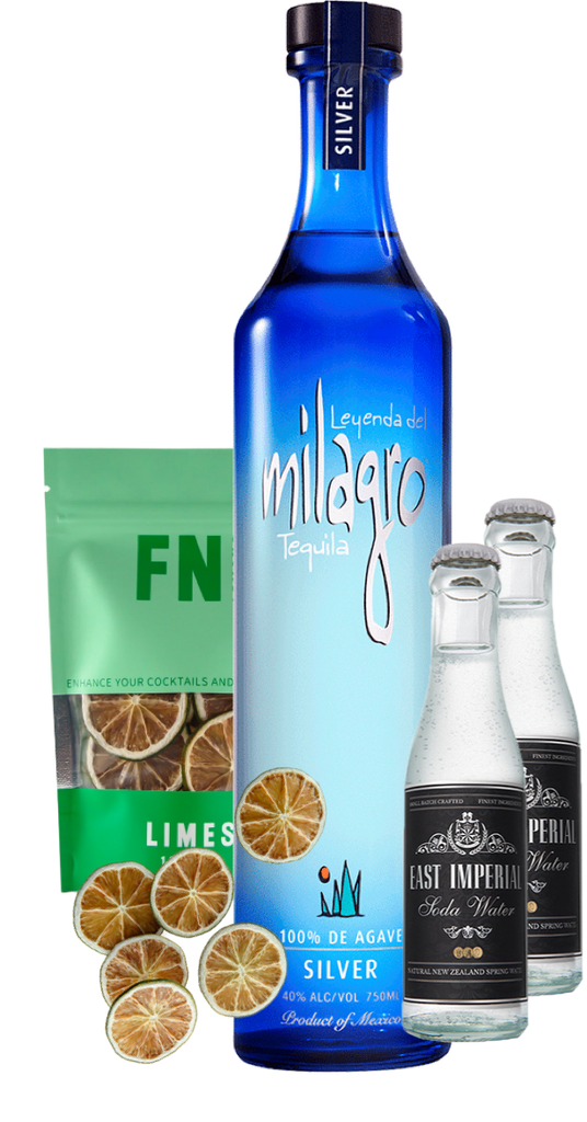 An image of a Milagro Silver Tequila Gift Box including 2 east imperial soda waters and a pouch on Lime garnish slices