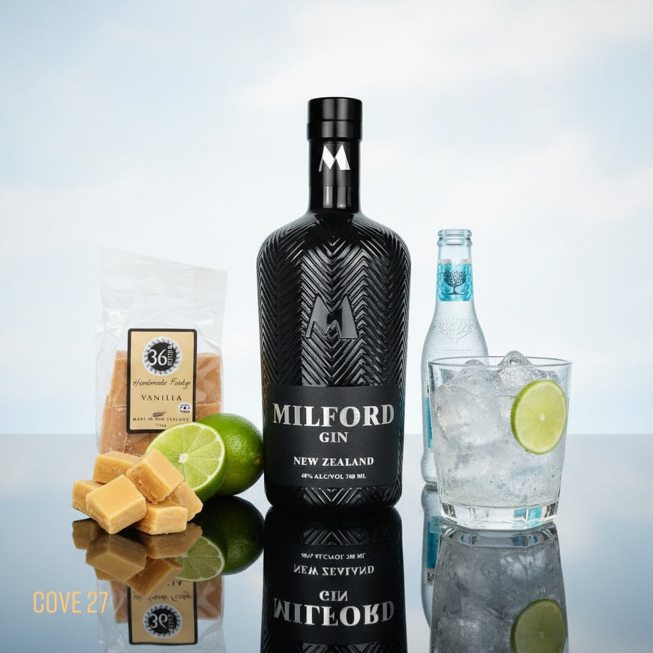 Load image into Gallery viewer, Milford Gin bottle with a glass of gin and tonic, lime, and cookies on a reflective surface.