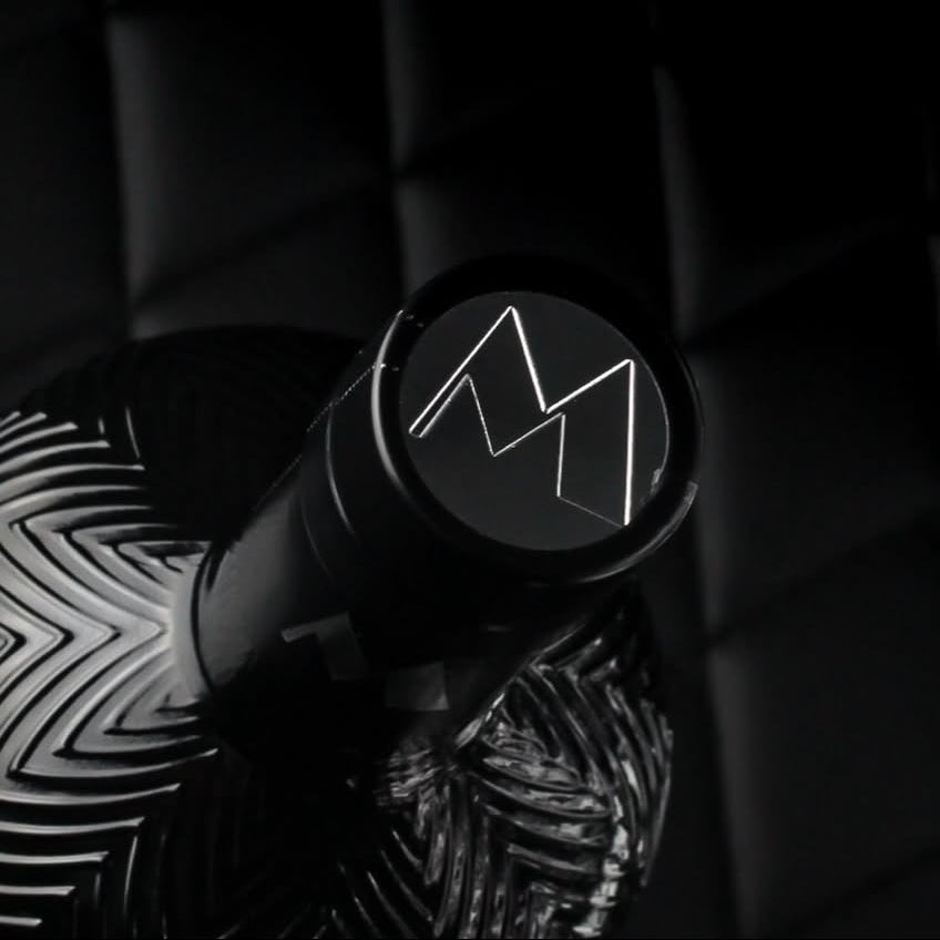 Load image into Gallery viewer, Top view of Milford Gin bottle showing its unique 'M' logo