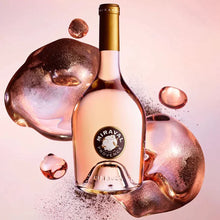 Load image into Gallery viewer, A bottle of rose wine on a pink background with some pink bubbles on it.