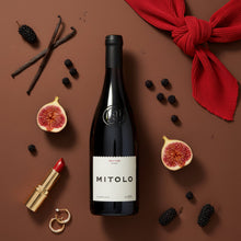 Load image into Gallery viewer, Bottle of Mitolo-Savitar-Shiraz wine with figs, blackberries, vanilla beans, and a red lipstick on a brown background.