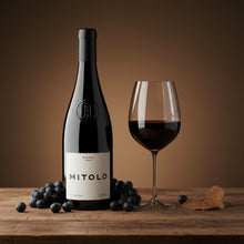 Load image into Gallery viewer, Bottle of Mitolo-Savitar-Shiraz wine with a glass of wine and grapes on a wooden table.