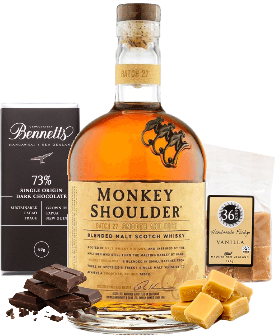 Load image into Gallery viewer, Bottle of Monkey Shoulder whisky with chocolate and fudge on a white background