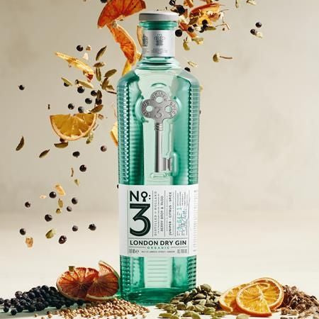 Load image into Gallery viewer, Bottle of No. 3 London Dry Gin with garnishes on a beige background