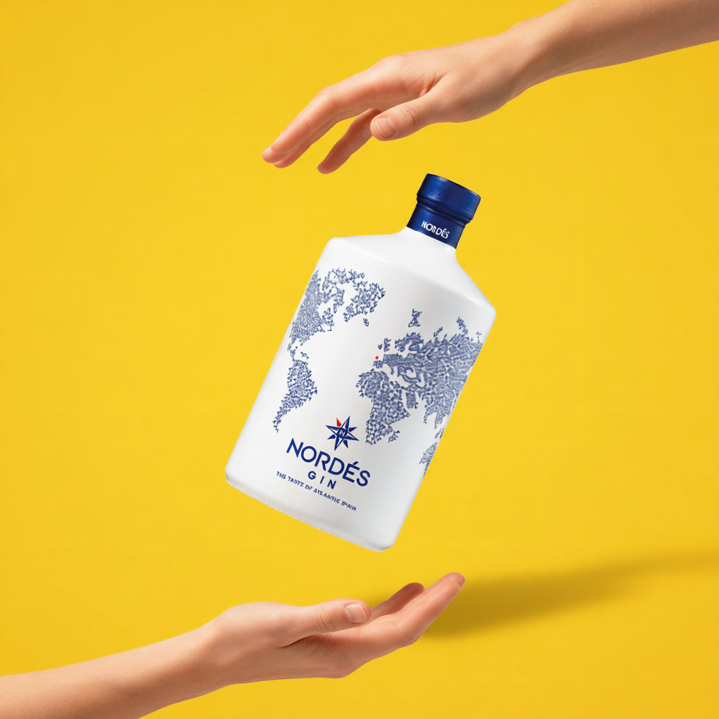 Load image into Gallery viewer, A bottle of Nordes Gin floating in the air between two women hands
