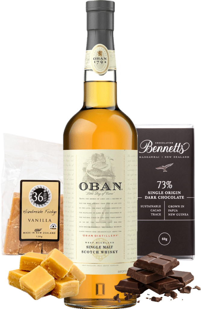 Oban 14 year old whisky bottle with chocolate and fudge on a white background