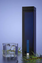 Load image into Gallery viewer, An image of a bottle of One Key Gin next to a stunning cocktail glass.