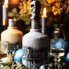 Load image into Gallery viewer, Padre Super Premium Tequila Blanco bottle with skull design on a decorative table.