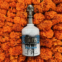 Load image into Gallery viewer, Bottle of Padre-Azul-Blanco-Tequila surrounded by orange marigold flowers.