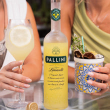 Load image into Gallery viewer, Pallini Limoncello bottle with two people holding drinks in a casual setting
