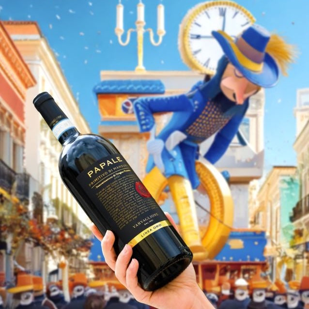 Load image into Gallery viewer, A bottle of Papale Oro Varvaglione Primitivo di Manduria red wine being held in the air at a colourful parade