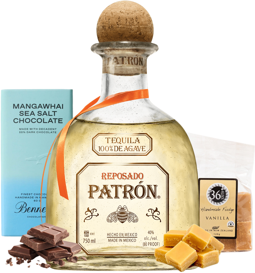 Patrón Reposado tequila bottle with chocolate and caramels on a white background