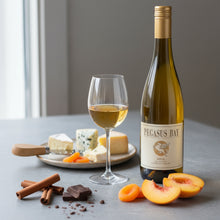 Load image into Gallery viewer, Bottle of Pegasus Bay Aria Late Picked Riesling white wine with a glass of wine, cheese platter, and fruits on a table.
