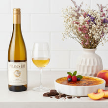 Load image into Gallery viewer, Bottle of Pegasus Bay Aria Late Picked Riesling white wine, glass of white wine, creme bréleé, and fruit on a table.
