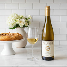 Load image into Gallery viewer, Bottle of Pegasus Bay Aria Late Picked Riesling white wine with a glass and pie on a countertop.