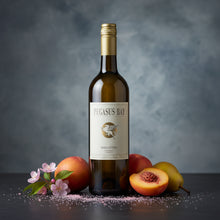 Load image into Gallery viewer, Bottle of Pegasus Bay Minuetto Sauvignon Semillon wine with fruits and flowers on a dark surface