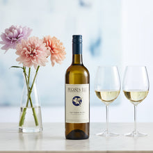 Load image into Gallery viewer, Bottle of Pegasus Bay Sauvignon Blanc with two glasses of wine and flowers on a table.