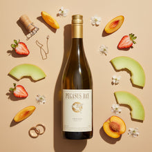 Load image into Gallery viewer, Pegasus Bay Virtuoso Chardonnay wine bottle surrounded by fruit slices on a beige background