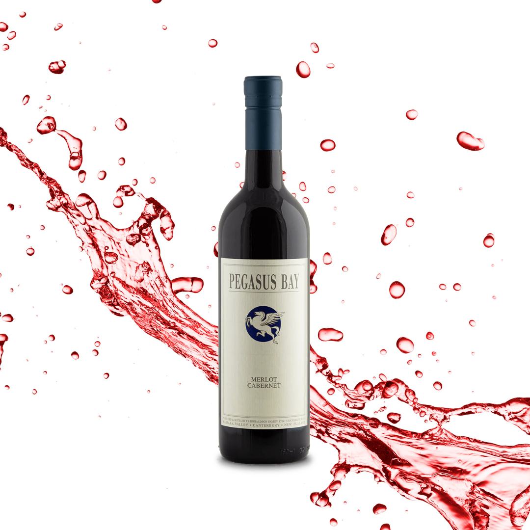 Load image into Gallery viewer, A bottle of Pegasus Bay merlot cabernet red blend wine being splashed with wine