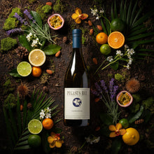 Load image into Gallery viewer, Bottle of Pegasus Bay Chardonnay wine surrounded by fruits and flowers on a dark surface