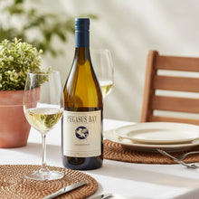 Load image into Gallery viewer, Bottle of Pegasus Bay Chardonnay with two glasses on a table setting outdoors.