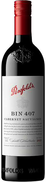 A bottle of Penfolds Bin 407 Cabernet Sauvignon red wine, featuring a dark glass bottle, a red foil top, and a white label with red and black text.