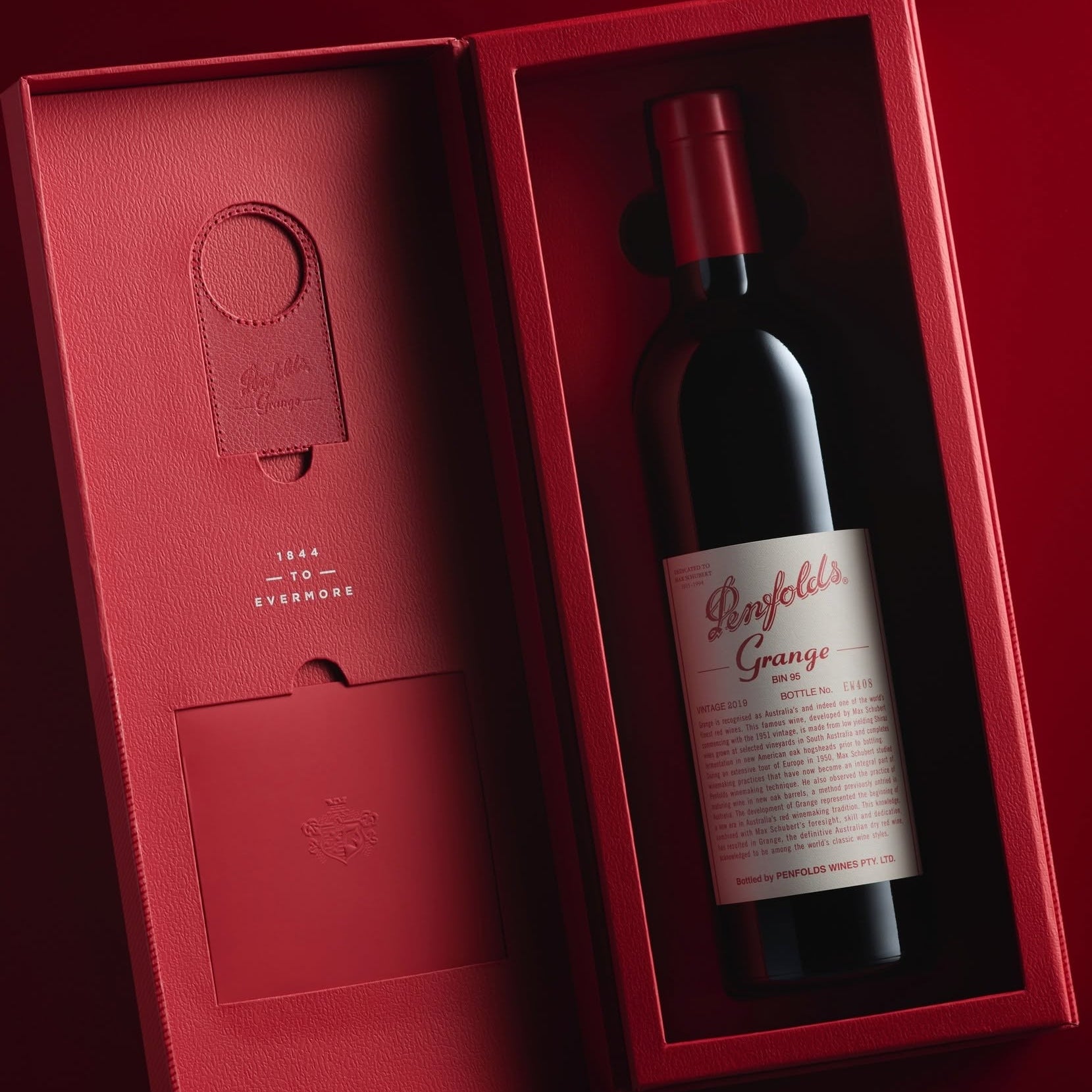 Load image into Gallery viewer, Penfolds Grange wine bottle in a red gift box on a dark background