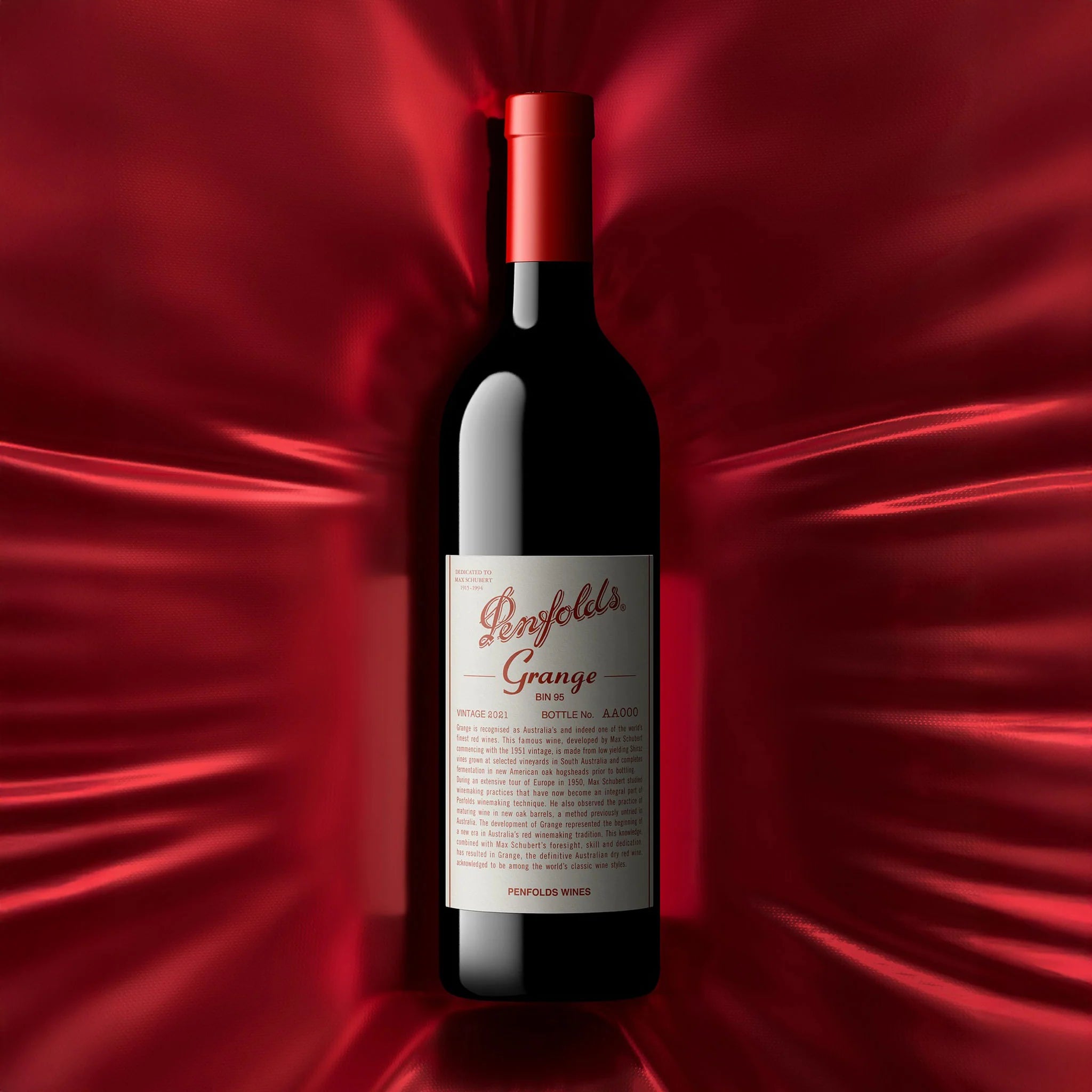 Load image into Gallery viewer, Penfolds Grange wine bottle on a red fabric background