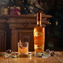 Load image into Gallery viewer, Bottle of Pierre Ferrand cognac with a glass of cocktail on a wooden surface.