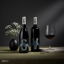 Load image into Gallery viewer, Bottles of Poderi Crisci Syrah and Viburno Red wines next to each other and a glass of red wine on a dark background.