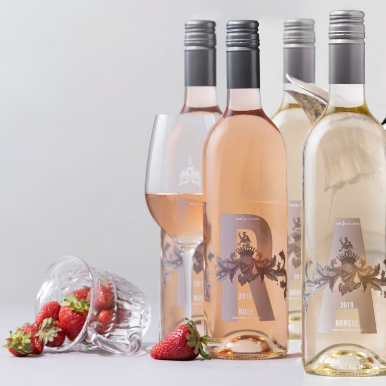 Load image into Gallery viewer, Four bottles of Poderi Crisci wines with a glass and strawberries on a light gray background