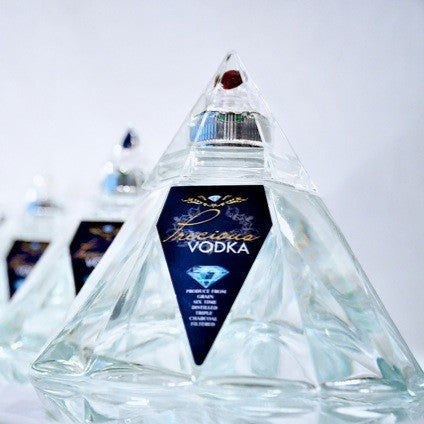 Load image into Gallery viewer, Diamond shaped Precious Vodka bottles in a row on a white background