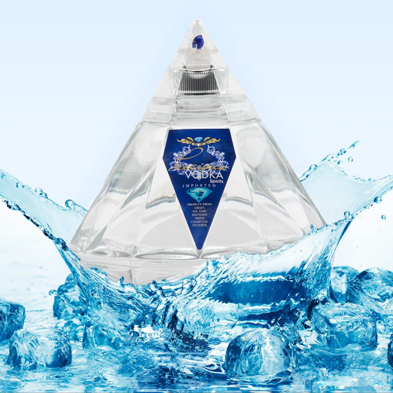 An inviting lifestyle image of a bottle of Precious Vodka splashing into water with ice cudes.
